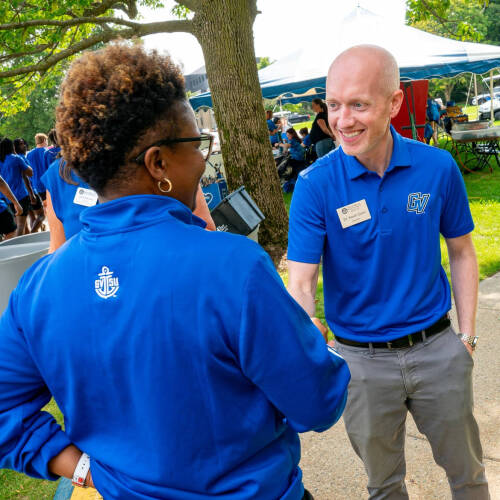 Kevin Conn, assistant vice president for Student Affairs, Housing and Residence Life, talks with Myesha Gholston, director of the Laker Academic Advising Center, during the first day of move-in on the Valley Campus.